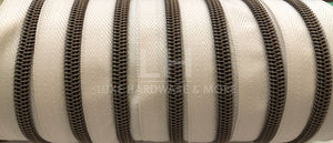 #5 Ivory Color Tape With Antique Gold Nylon Teeth $1.50/yard